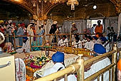 Amritsar - the Golden Temple - scriptures from the Holy Book, the Guru Granth Sahib, are continously singed (known as the Akhand Path). 